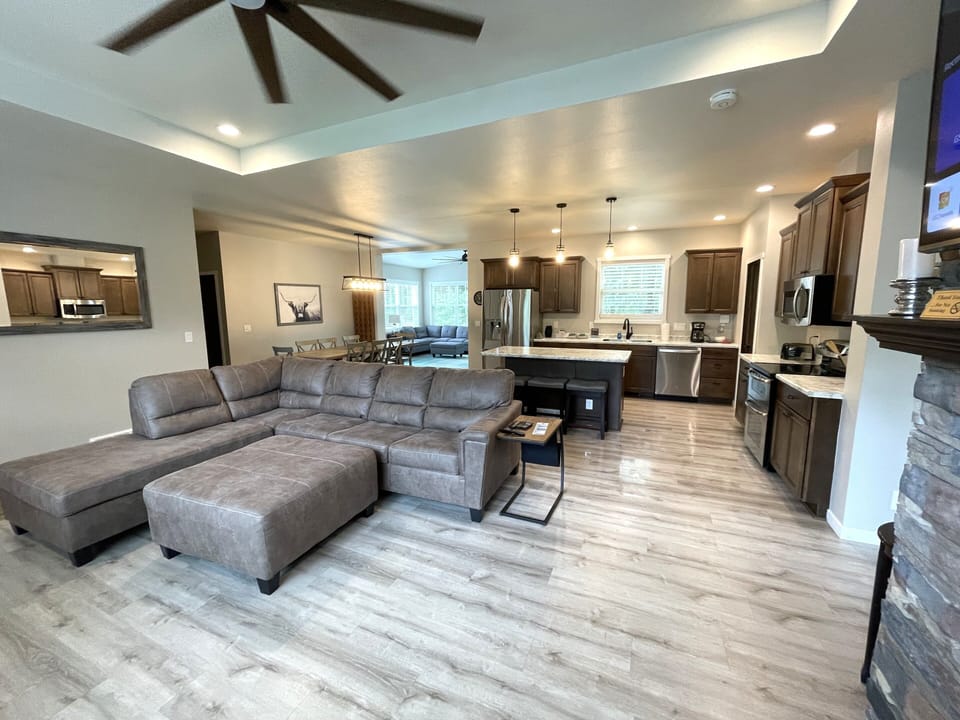Living Room with Cozy Seating, Queen Sofa Sleeper, TV & Fireplace
