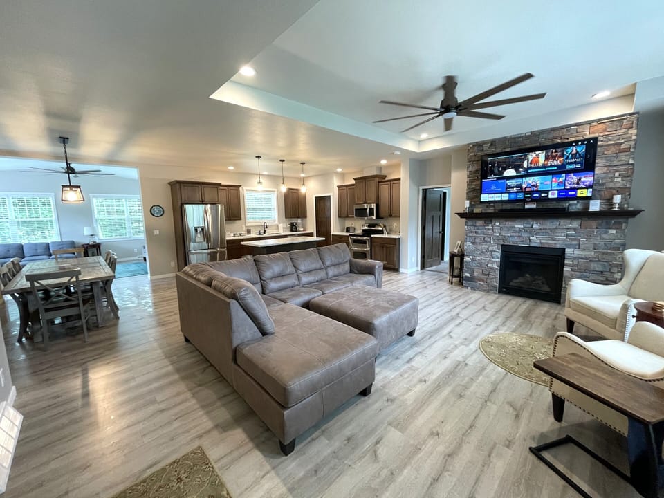 Living Room with Cozy Seating, Queen Sofa Sleeper, TV & Fireplace