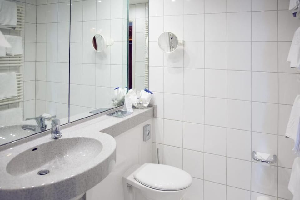 Bathtub, hair dryer, towels, soap