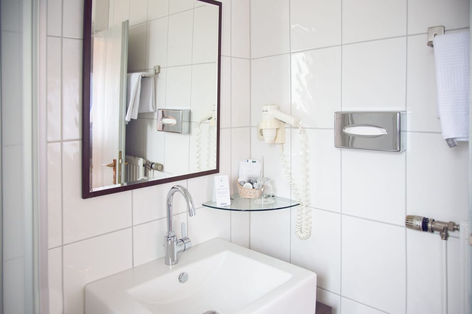 Bathtub, hair dryer, towels, soap