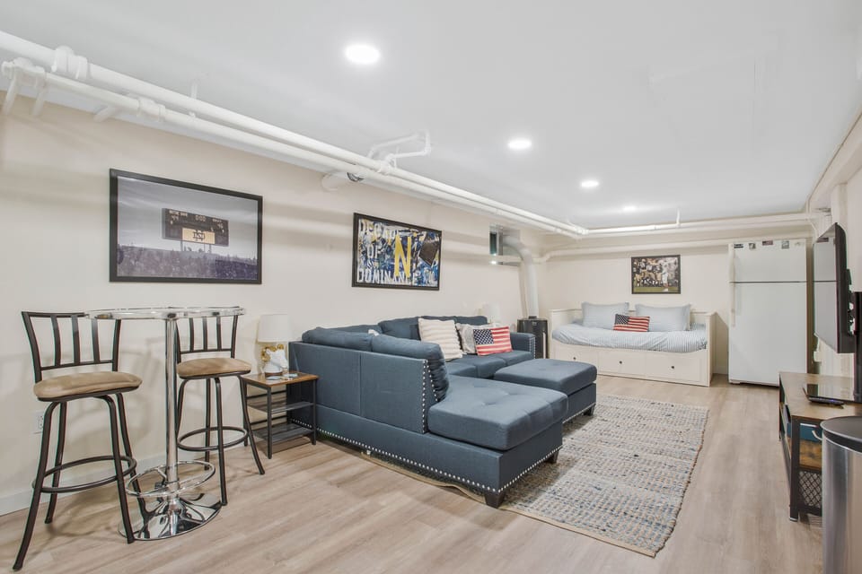 Finished basement. Equipped with full washer and dryer and convertible king bed