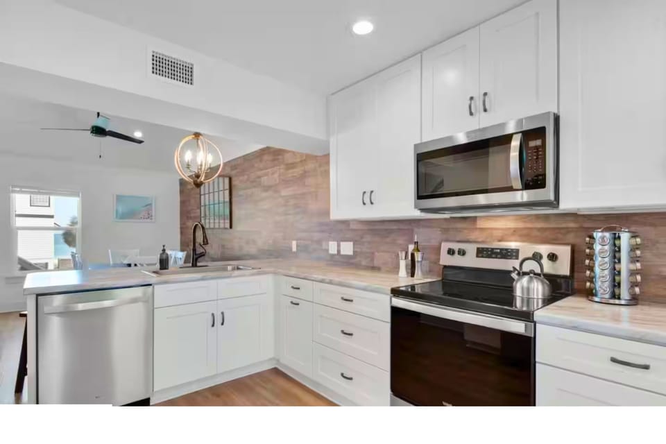 Modern kitchen combines style, function, and coastal charm.
