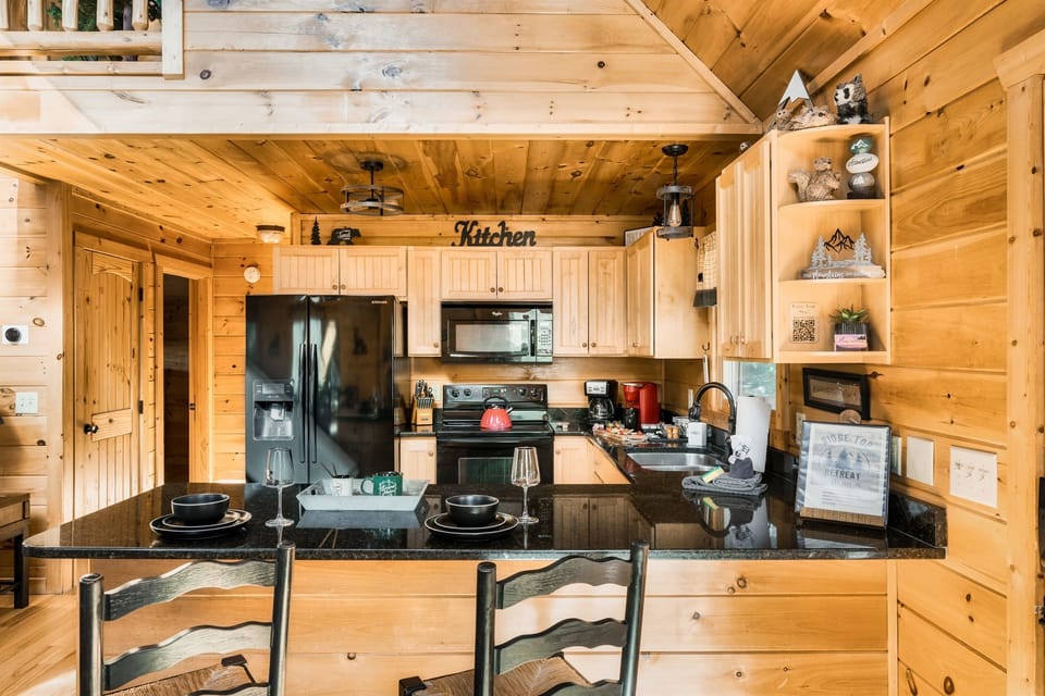 Everything you need to make our cabin your home-Refrigerator with ice/water dispenser, coffee maker, stove, microwave, and dishwasher.