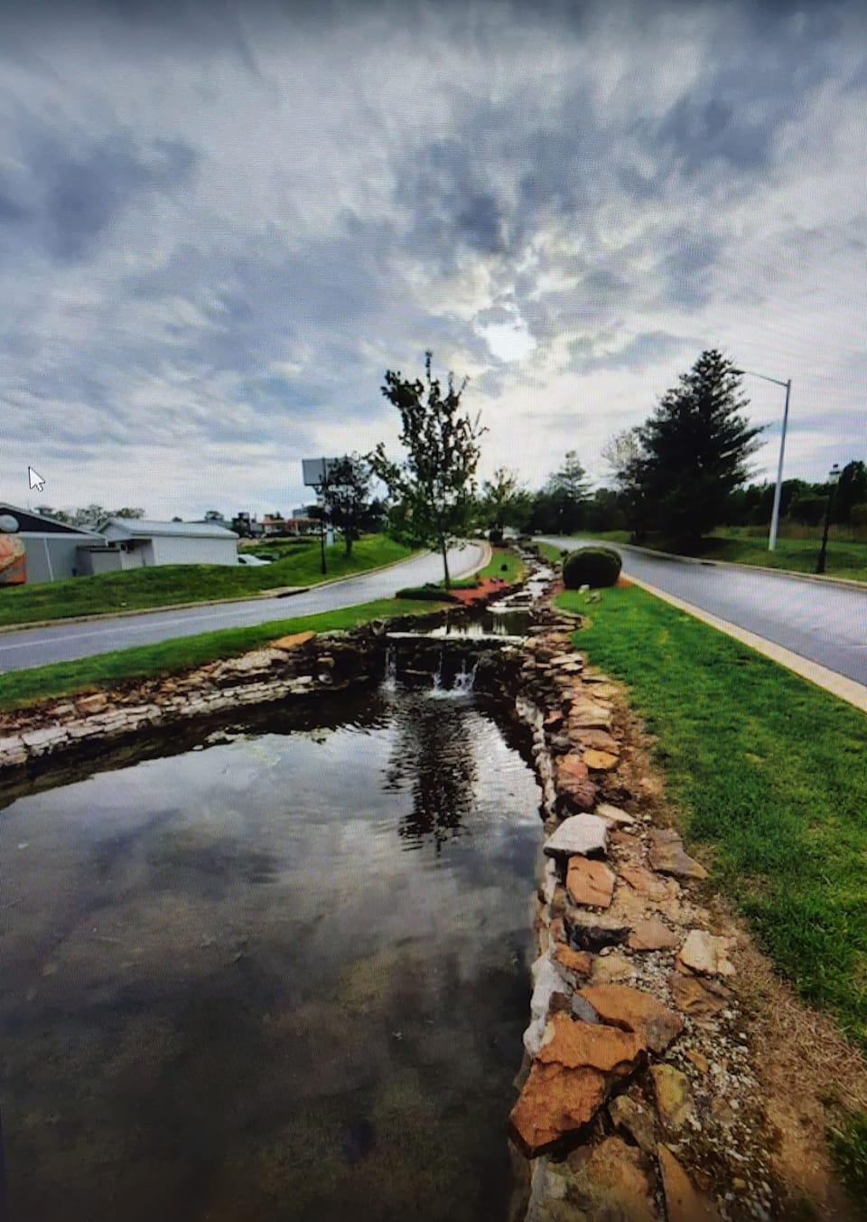 Beautifully landscaped stream throughout entrance to the community!