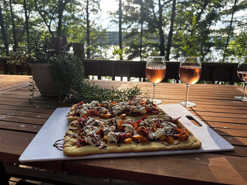Dinner on the deck with lake views and Finger Lakes Wine.