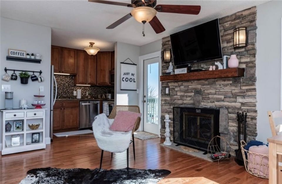 Fully stocked kitchen for meals, coffee, and everything in between. Kitchen with coffee station off the living room and door leading to the smaller balcony.