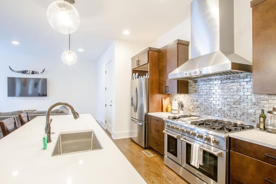 A professional-grade kitchen with double oven and commercial-style range is a chef`s dream.