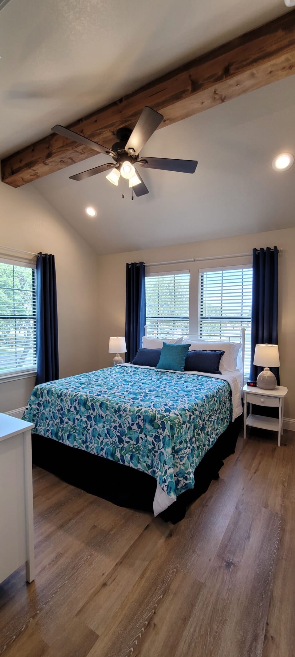 Bedroom 1 with cathedral ceilings and wood beams.