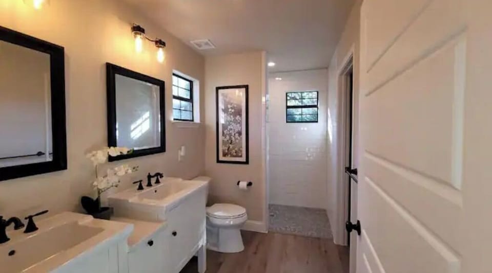 Bathroom 2 with walk-in shower and double sinks.