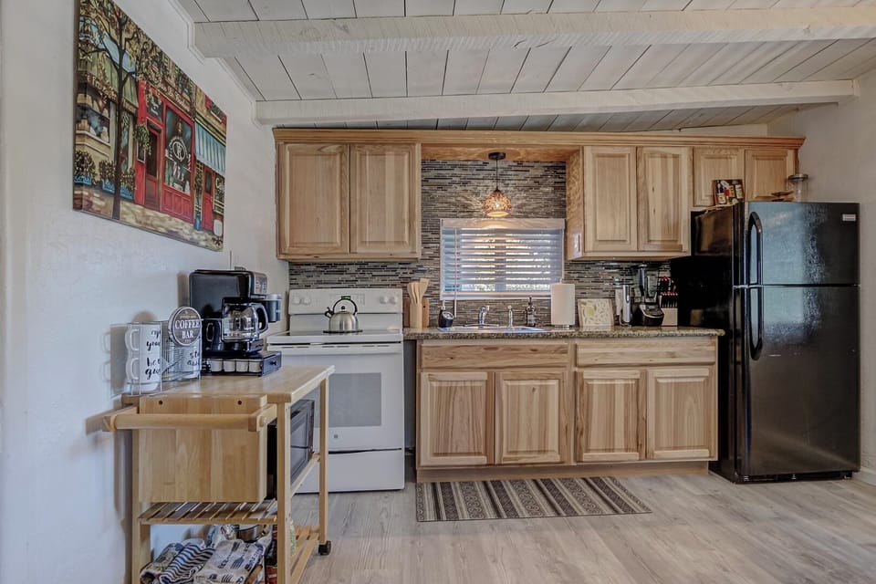 The kitchen is fully stocked with every cooking utensil you might need. 
