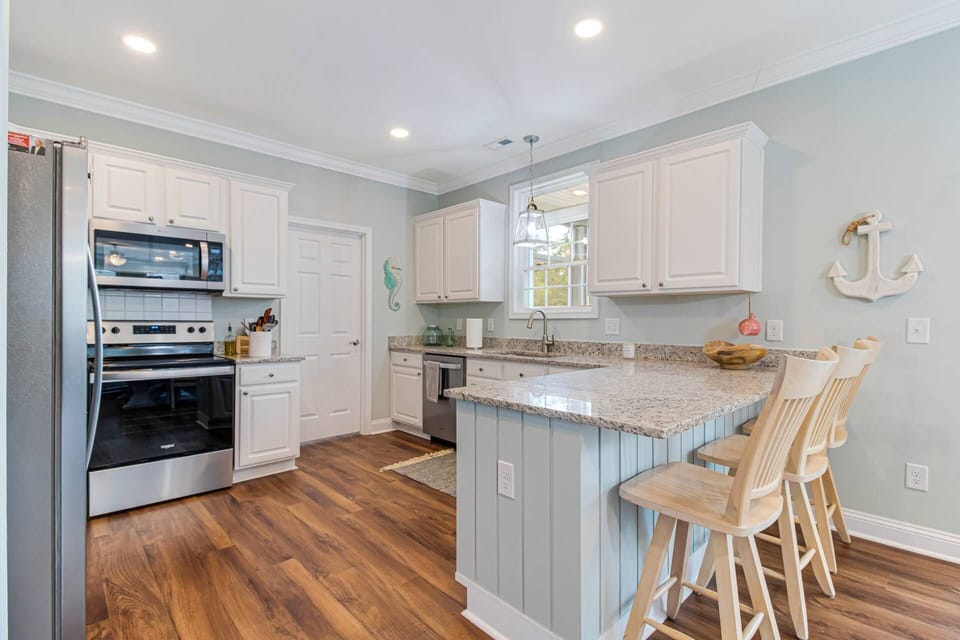 Large modern kitchen with bar stools