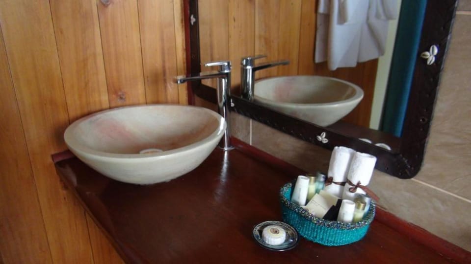 Combined shower/tub, bathrobes, slippers, towels
