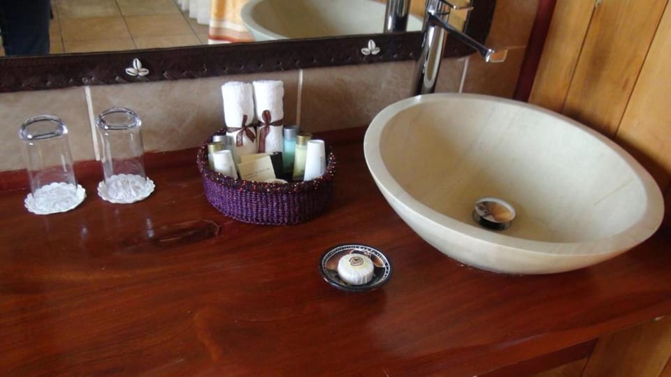 Combined shower/tub, bathrobes, slippers, towels