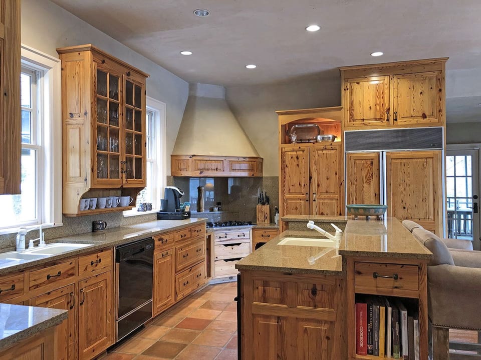 Well-stocked Kitchen includes gas cook top, 2 sinks, beautiful custom cabinets and lots of work-surface... perfect cooking space for larger groups and holidays.