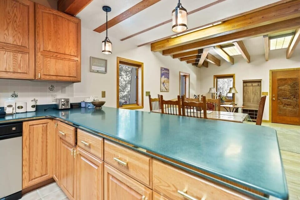 This spacious peninsula allows for bar seating or a convenient spot to serve your latest culinary creation to those waiting at the dining table.