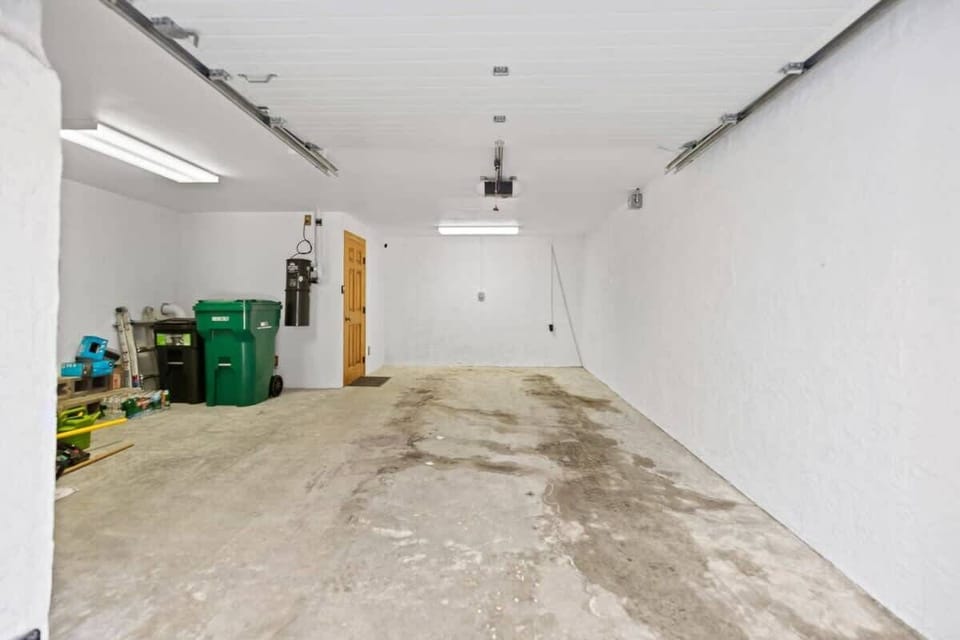 A large garage space for your convenient use, with plenty of additional parking available in the driveway.
