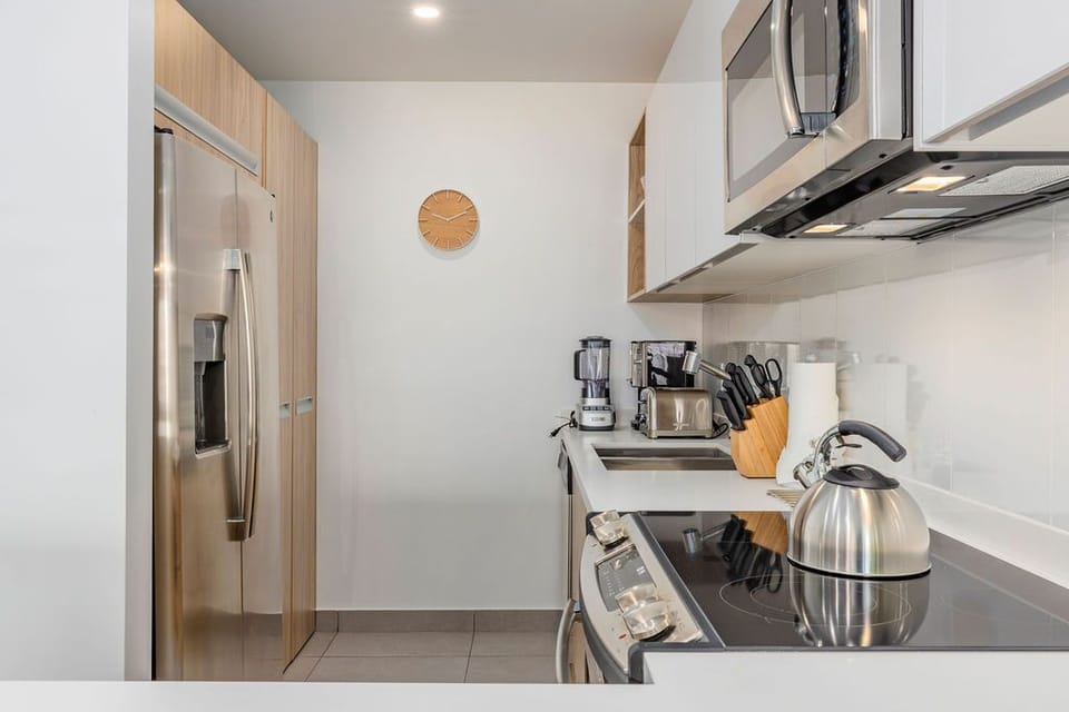 Your fully equipped kitchen has everything you need to prepare delicious meals, from a full-size fridge to modern appliances and ample counter space—plus a cozy coffee nook ready for your morning routine.