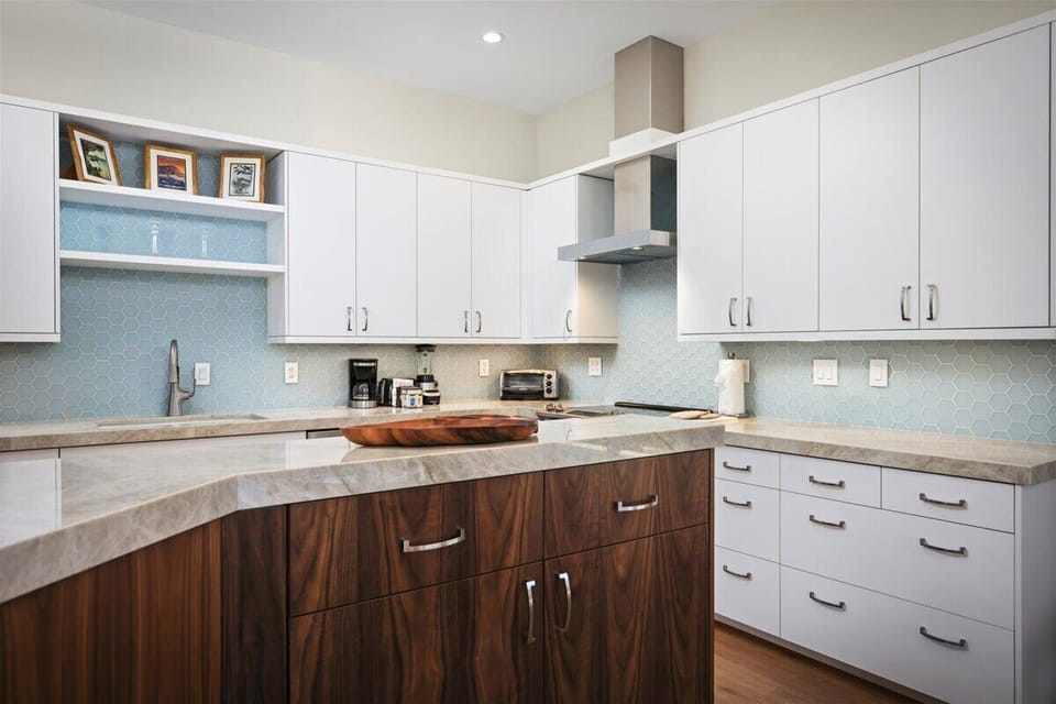 Your fully-equipped kitchen features sleek countertops, modern appliances, and abundant storage—perfect for whipping up your favorite meals with style and ease.