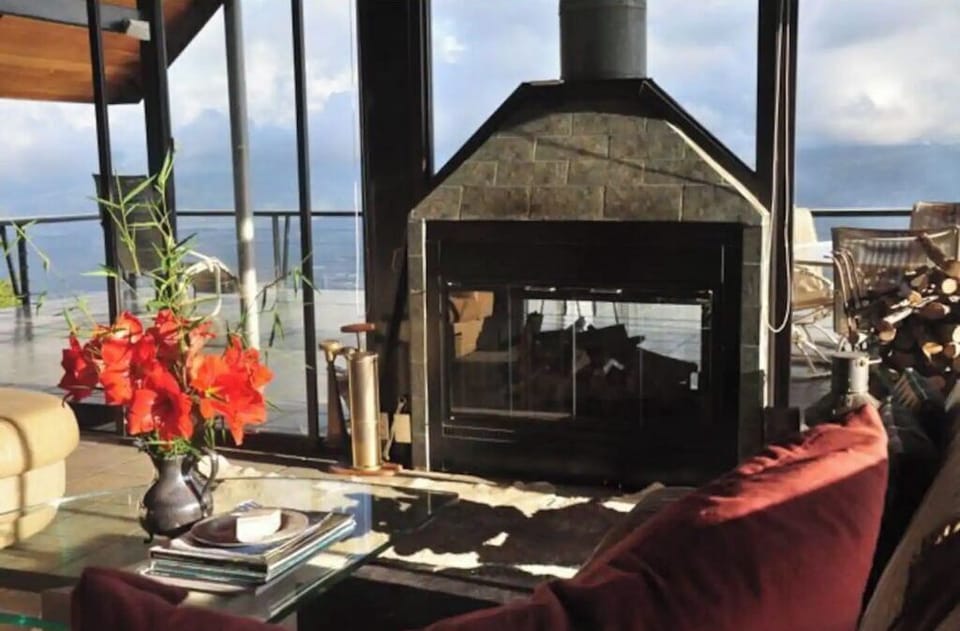 Both inside and on the deck, the fireplace warms and mesmerizes