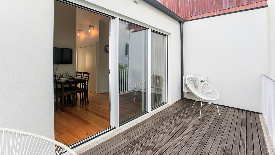 Unwind on your spacious private balcony, an ideal spot to dine al fresco or simply soak up the sun, with direct access to the elegant indoor dining area through sliding glass doors. The seamless flow between spaces enhances your vacation experience.