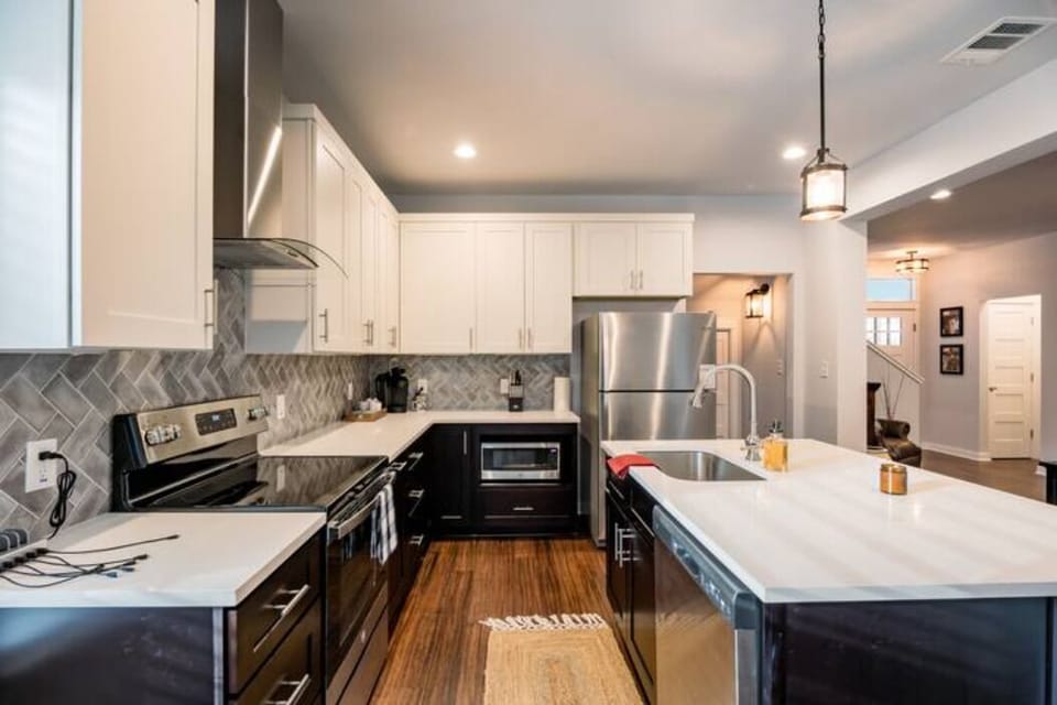 Kitchen with brand new appliances including dishwasher, microwave, stove/oven