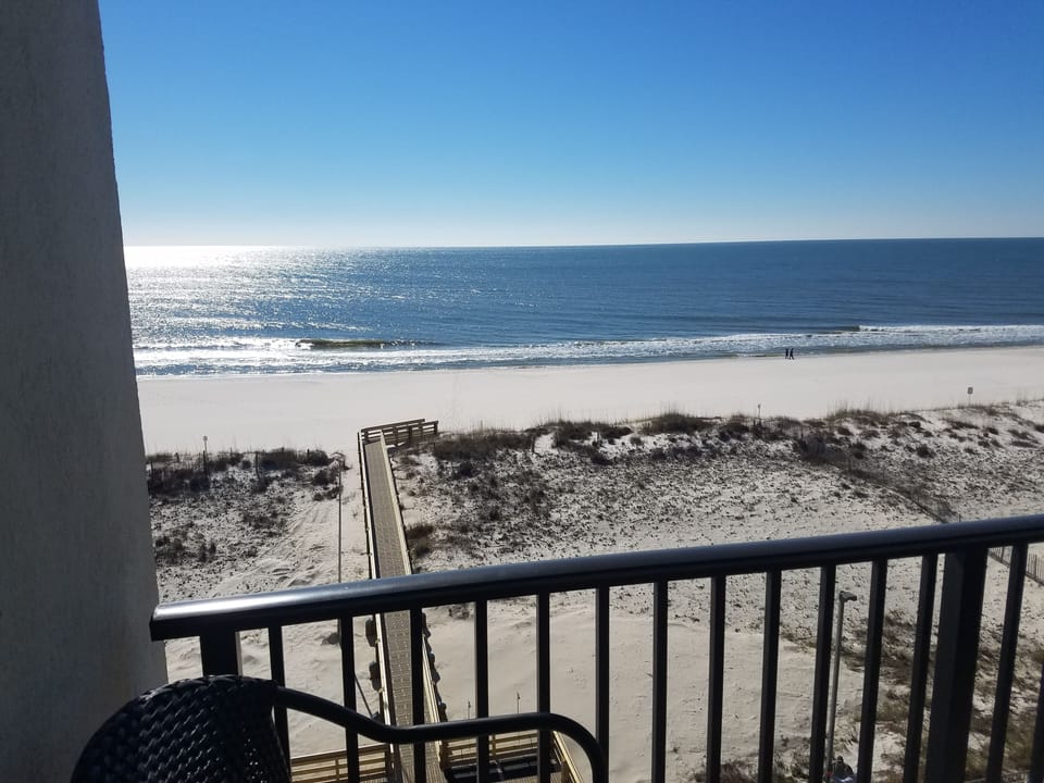 View of walkway to beach from balcony.