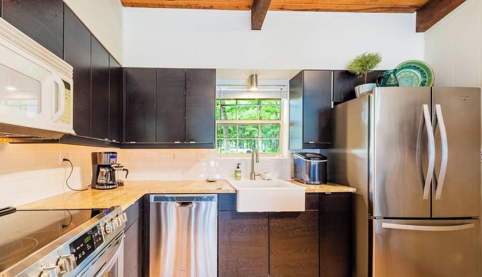 Fully equipped kitchen with gorgeous view of the East Texas neighborhood and the lake.