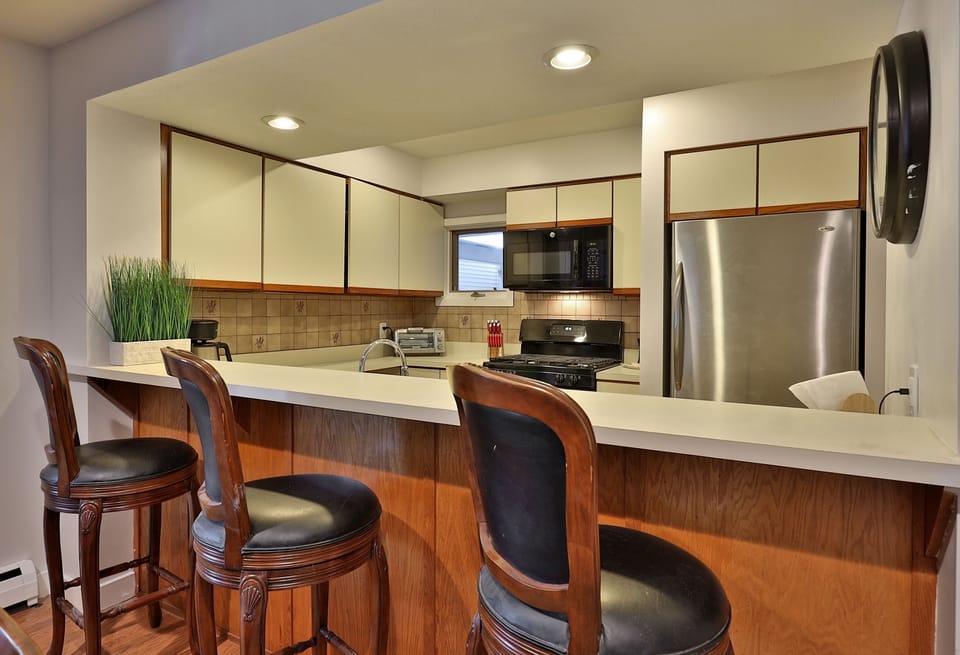 View from dining to fully equipped kitchen