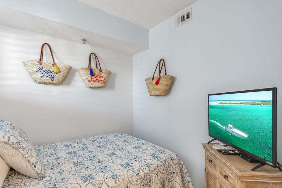 Sink into comfort with your cozy beach-themed bedroom, complete with charming nautical touches and entertainment for perfect relaxation.