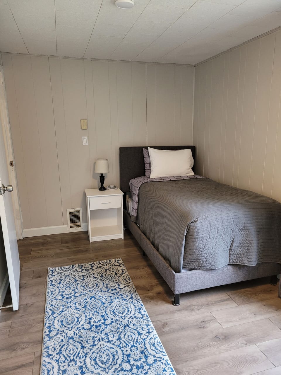 Twin bed that shares a room with the bunk bed as well.