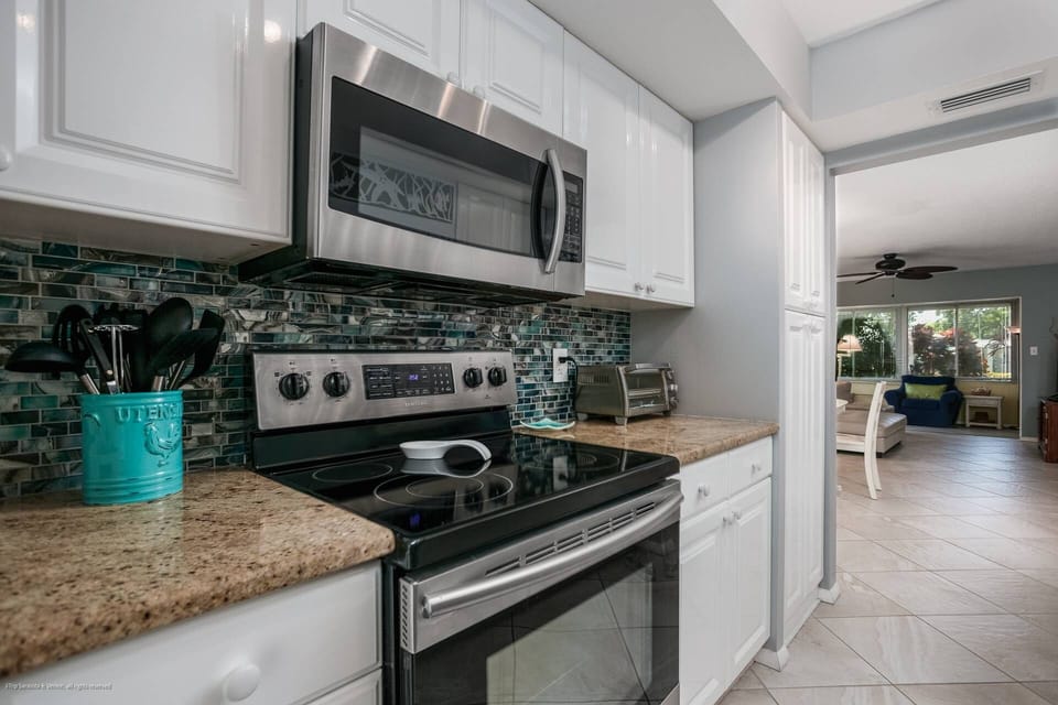 Stainless, granite kitchen is stocked with dishes, glasses, pots and pans.  Prepare your favorite meal in-house.