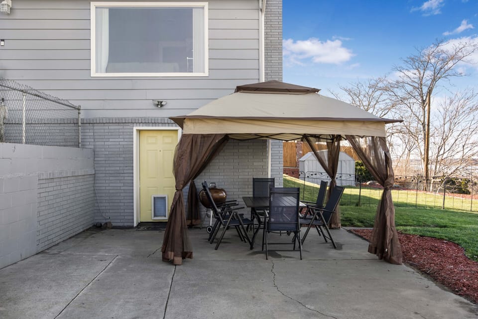 Private driveway and entrance. Seasonal gazebo and patio table has been moved. 