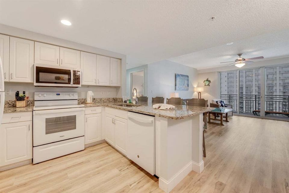 Kitchen with upgraded flooring and stunning granite countertops