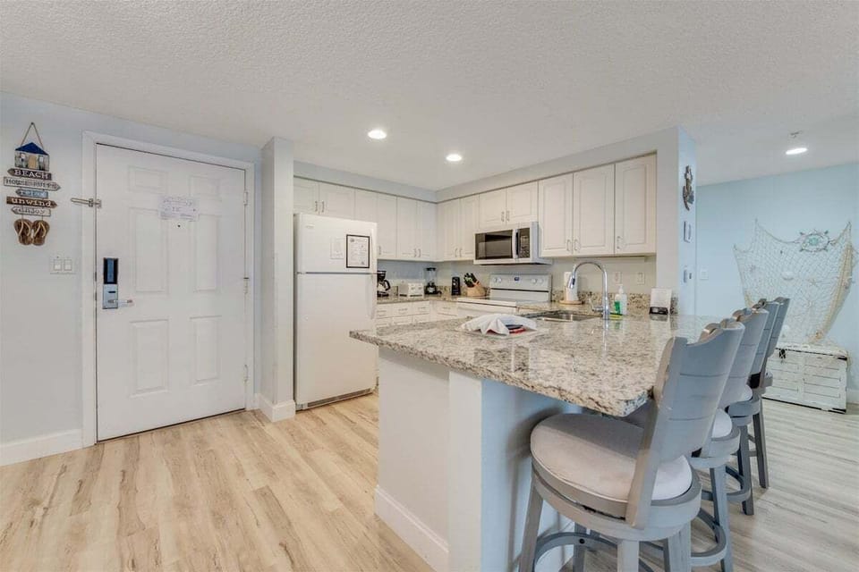 Extra large counter height granite tops and tons of space for extra seating