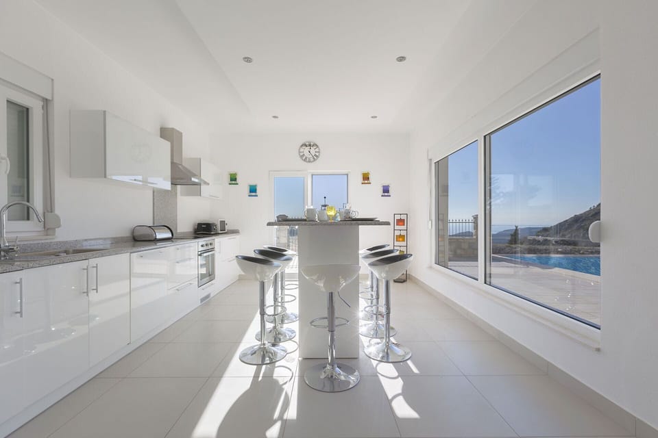 Breakfast at the bar to seat 8, patio doors open onto the pool & terrace