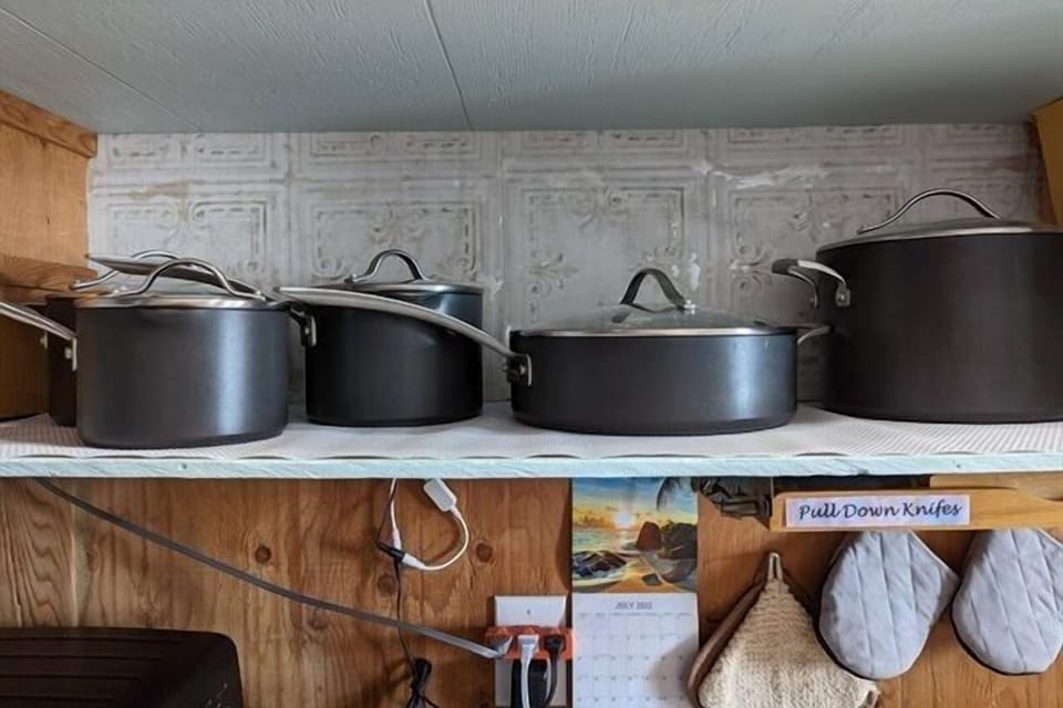 Pots & pans. Frying pans in oven drawer.