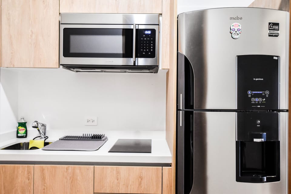 Deluxe Studio | Private kitchen | Full-size fridge, microwave, coffee grinder, cookware/dishes/utensils