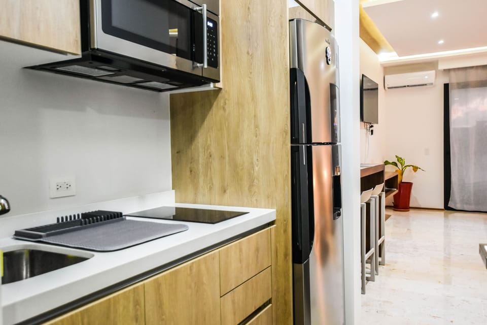 Deluxe Studio | Private kitchenette | Full-size fridge, microwave, coffee grinder, cookware/dishes/utensils