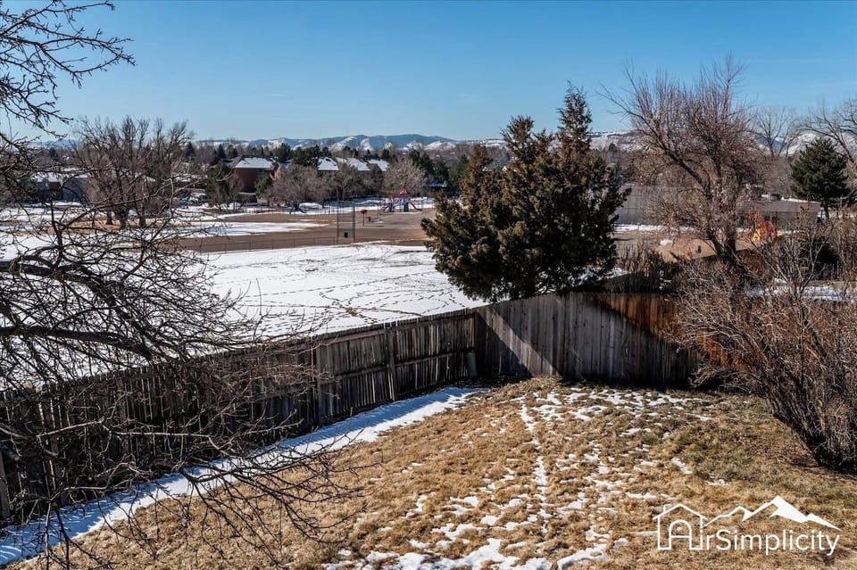 Take in the views of the nearby playground and lake from the huge fenced in backyard.