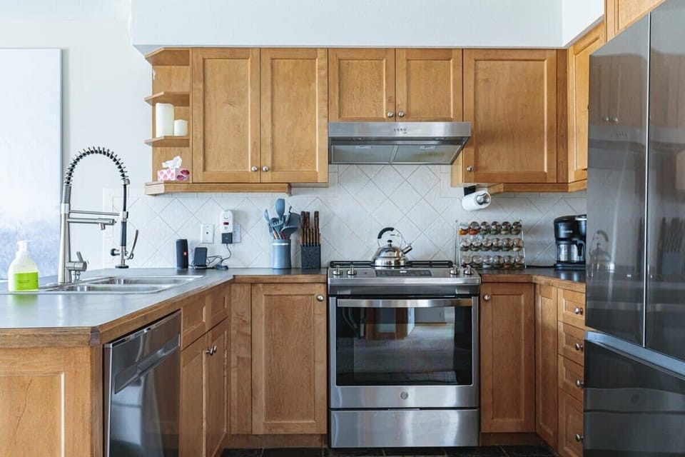 A well-appointed kitchen with plenty of cabinets, perfect for longer stays.