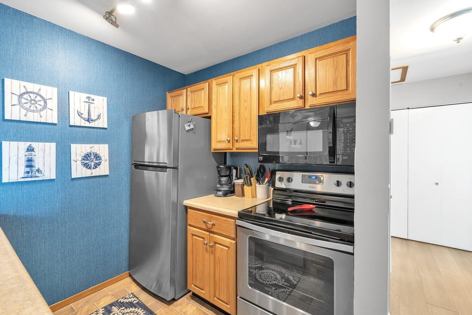 Kitchen has dishes, eating utensils, pots and pans if you want to dine in. 
