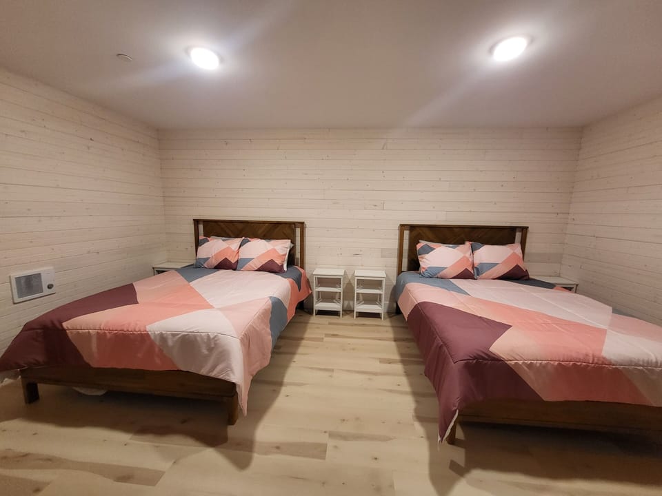 Bedroom #6 with 2 queen beds is located on the lower level