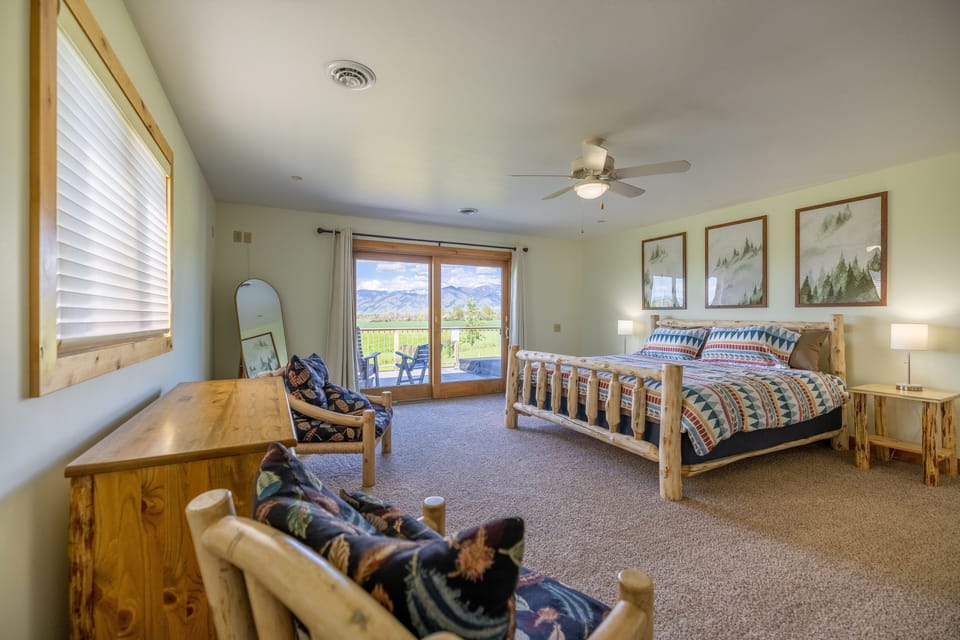 Master bedroom features a king bed, ensuite bathroom, and access to the deck