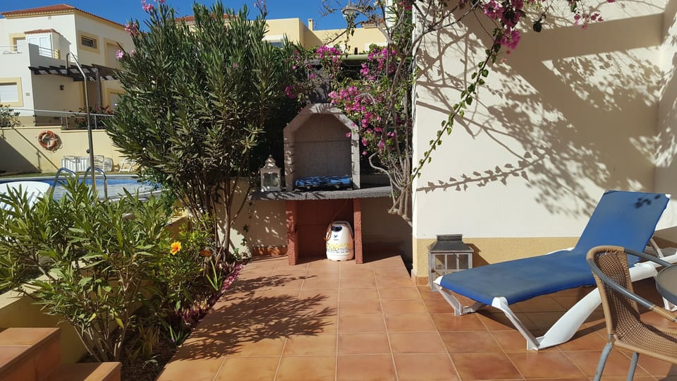 Terrace with BBQ leading to pool