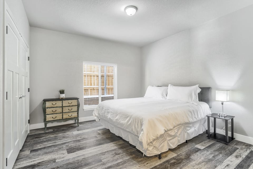 Master bedroom with a king sized bed
