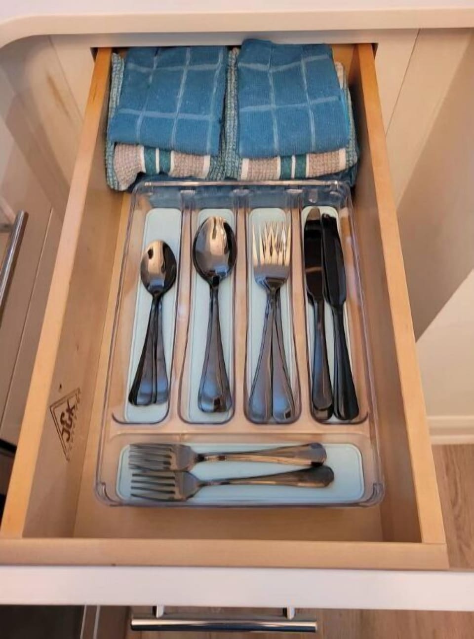 Kitchen towels and eating utensils
