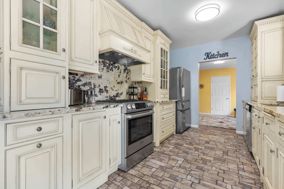 Modern appliance joined with retro dressings gives this kitchen character without taking away from the free flowing function