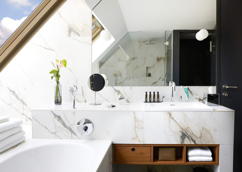 Designer toiletries, hair dryer, bathrobes, slippers