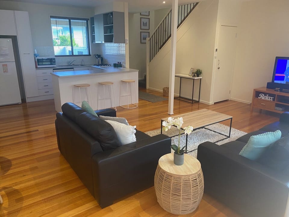 Relax in the open modern living area directly off the entry. 