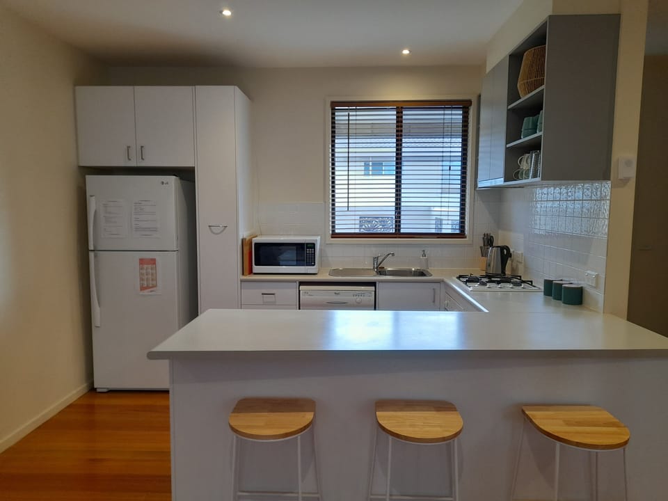 Fully equipped kitchen including dishwasher, oven, gas stove, microwave & fridge